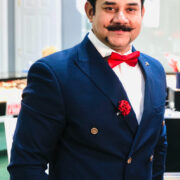 Tauqeer Imran, owner of Ron Jewelers in New Orleans, posing for his interview with Inside New Orleans magazine